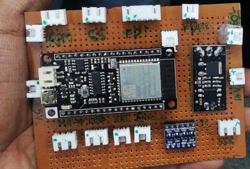 Custom ESP32-based control board with fingerprint sensor module and JST connectors for micromobility vehicle